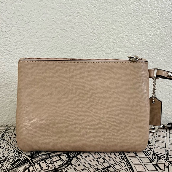Coach Wristlet with bow Color: Sand/tan 6.25"W x 4.25"H x .25 D - Picture 6 of 6